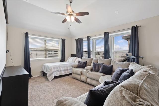 bedroom with multiple windows, carpet flooring, lofted ceiling, and ceiling fan