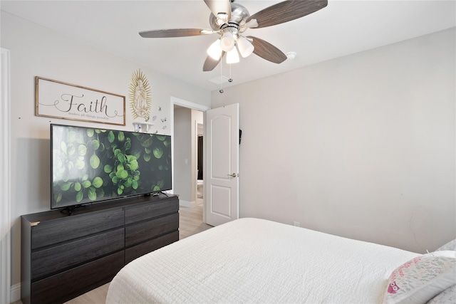 bedroom with light hardwood / wood-style flooring and ceiling fan