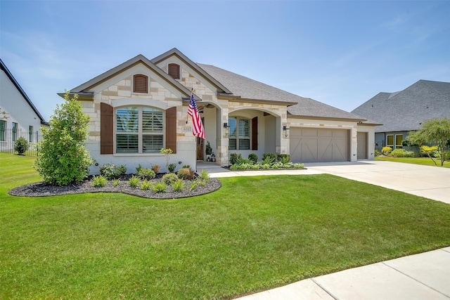 view of front facade with a front lawn and a garage