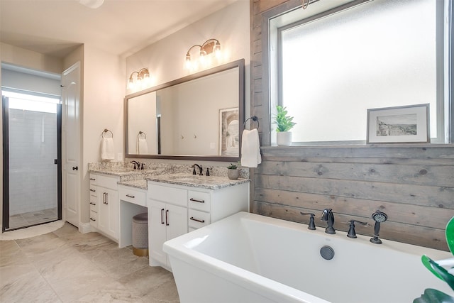 bathroom featuring vanity and shower with separate bathtub