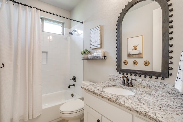 full bathroom featuring vanity, shower / bath combination with curtain, and toilet