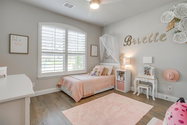 bedroom with dark wood-type flooring and ceiling fan