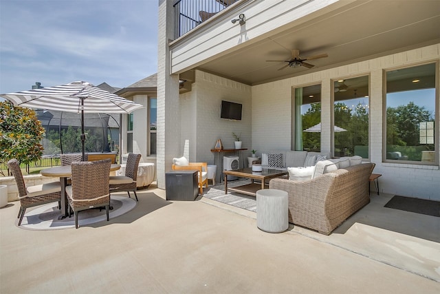 view of patio / terrace featuring a balcony, an outdoor living space, and ceiling fan