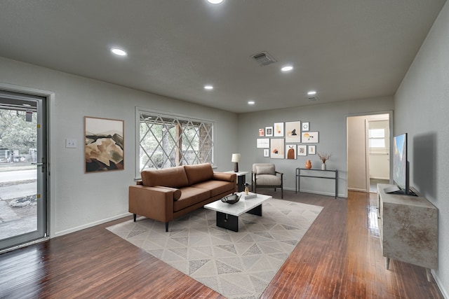 living room with light hardwood / wood-style floors and plenty of natural light