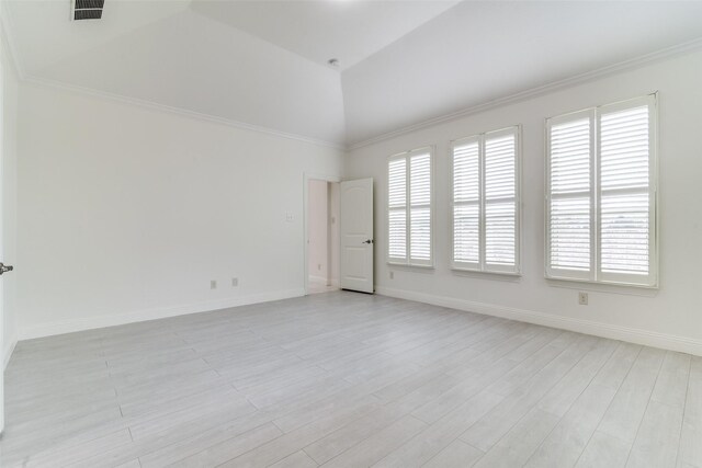 unfurnished room with healthy amount of natural light, light wood-type flooring, baseboards, and crown molding