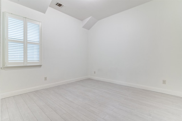 unfurnished room with light wood-type flooring