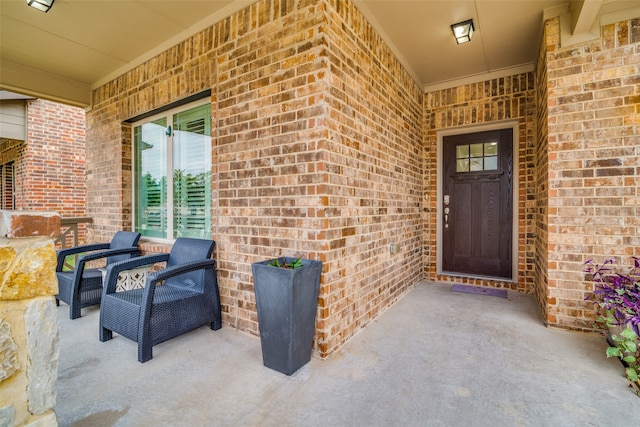 property entrance featuring a patio area