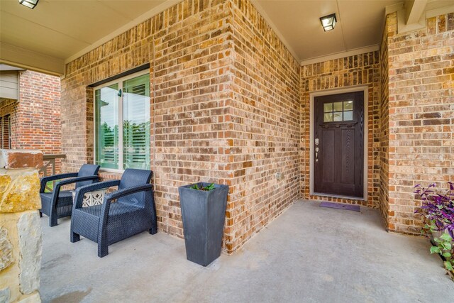 property entrance with brick siding