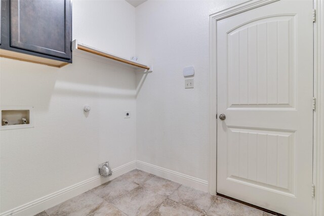 washroom featuring hookup for a washing machine, hookup for an electric dryer, baseboards, cabinet space, and light tile patterned floors