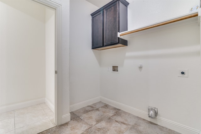 laundry area featuring hookup for a gas dryer, light tile patterned flooring, electric dryer hookup, and washer hookup