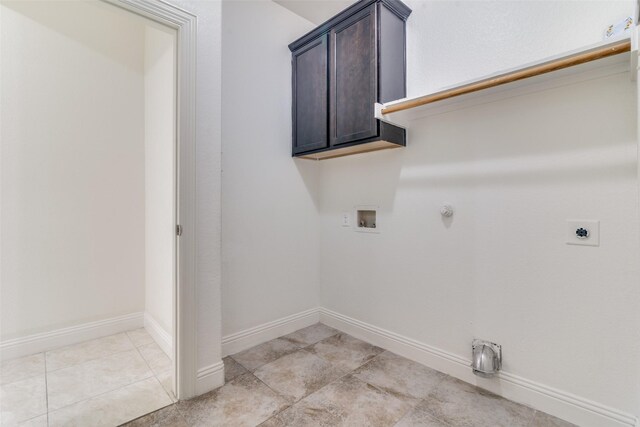laundry room featuring electric dryer hookup, washer hookup, hookup for a gas dryer, light tile patterned floors, and baseboards