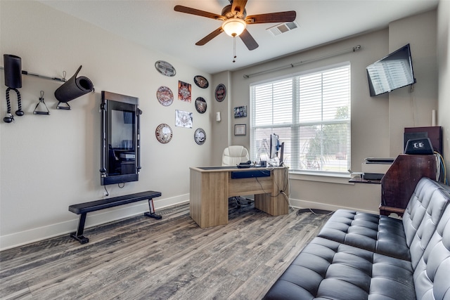 office with hardwood / wood-style floors and ceiling fan