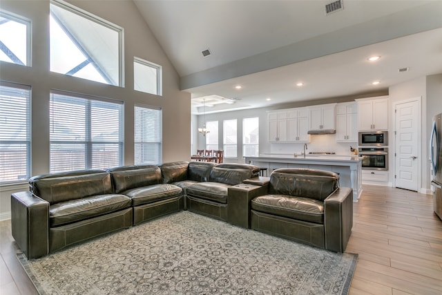 living room with light hardwood / wood-style floors and plenty of natural light