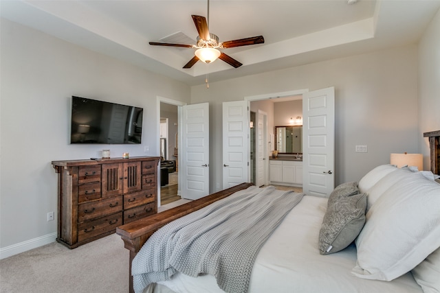 carpeted bedroom with connected bathroom and ceiling fan