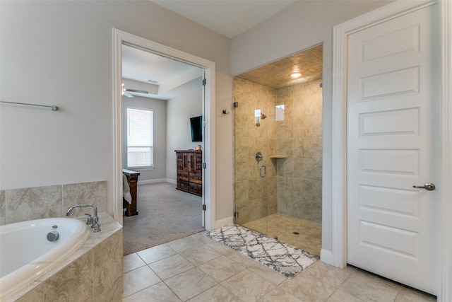 bathroom featuring independent shower and bath, tile patterned floors, and ceiling fan