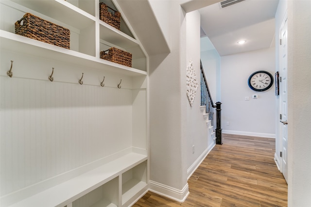 mudroom with hardwood / wood-style floors