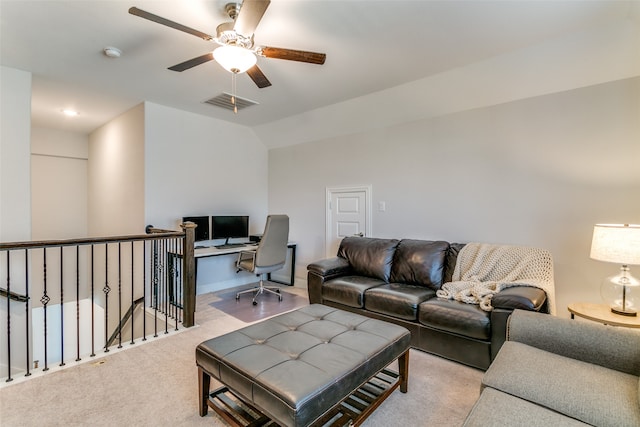 living room with light carpet, lofted ceiling, and ceiling fan