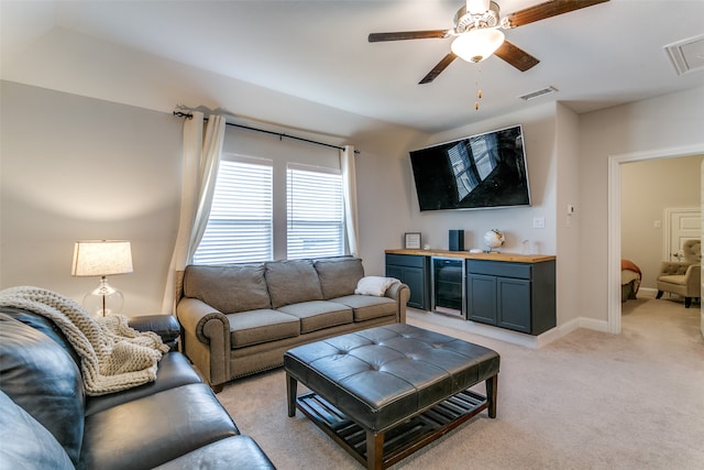 living room featuring ceiling fan and light carpet