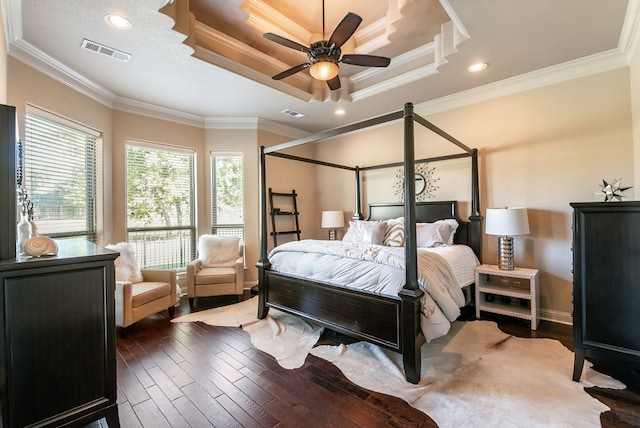 bedroom with ceiling fan, ornamental molding, and dark hardwood / wood-style flooring