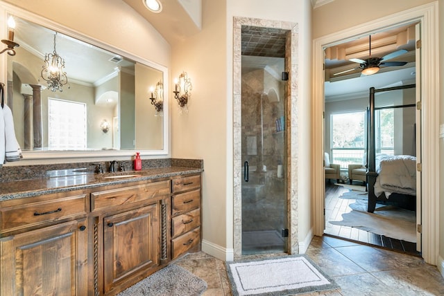 bathroom featuring vanity, ceiling fan, ornamental molding, and an enclosed shower