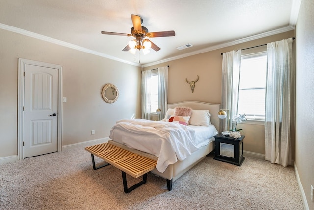 carpeted bedroom with ceiling fan, crown molding, and multiple windows