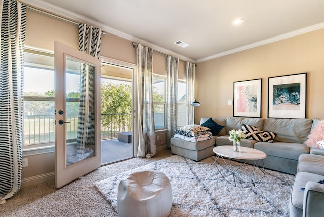 entryway with light carpet, french doors, and ornamental molding