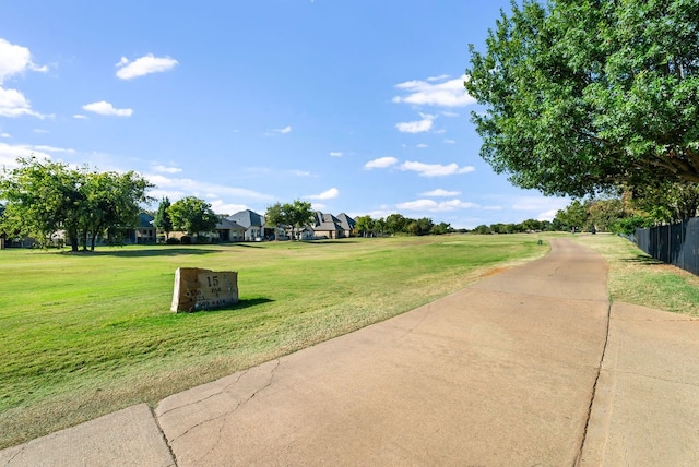 view of property's community featuring a lawn