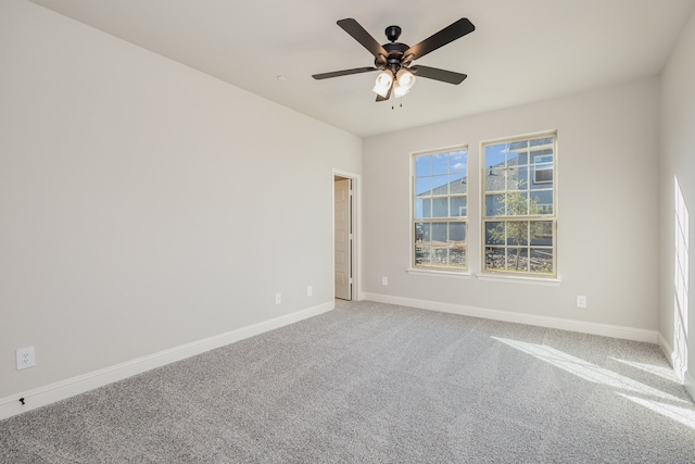 carpeted empty room with ceiling fan