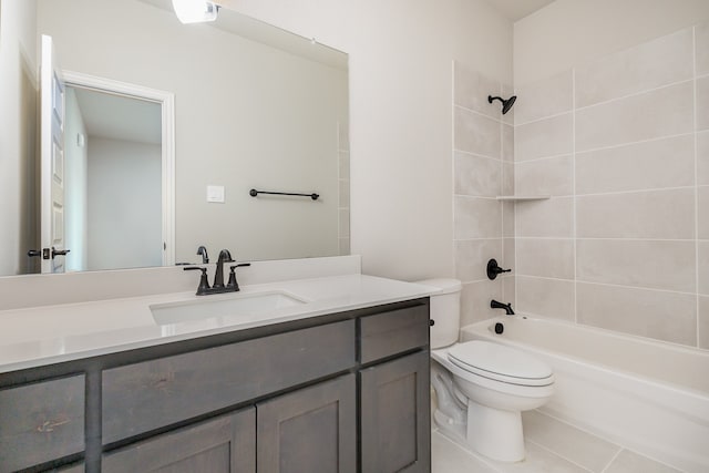 full bathroom with vanity, tiled shower / bath combo, toilet, and tile patterned floors