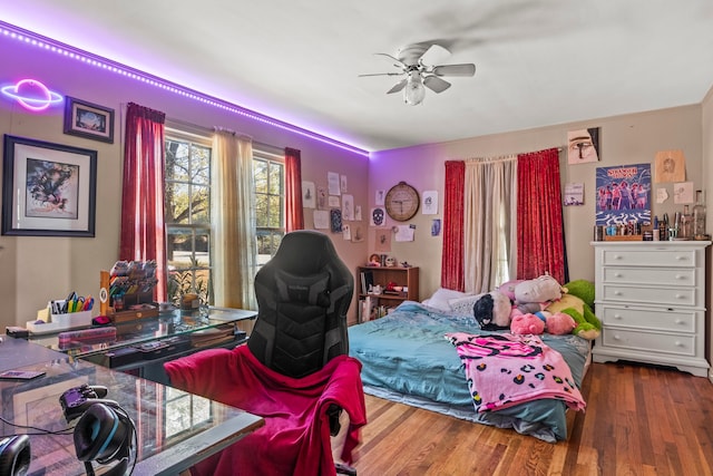 bedroom featuring hardwood / wood-style floors and ceiling fan