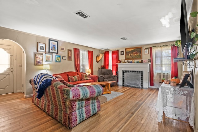 living room featuring hardwood / wood-style floors and a fireplace