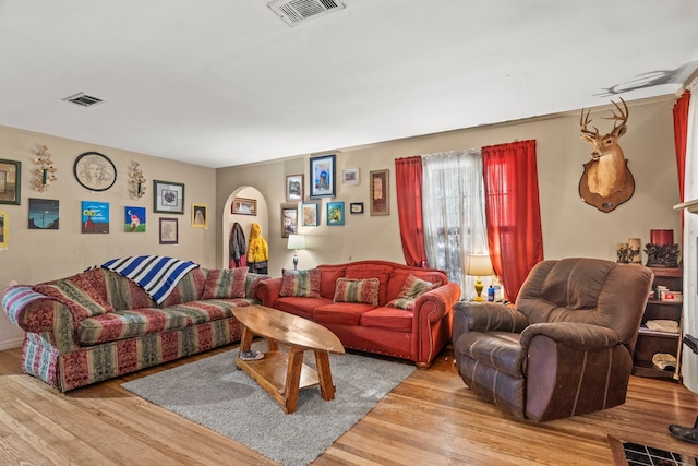 living room with light hardwood / wood-style flooring