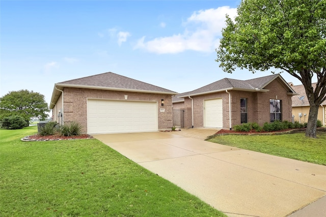 ranch-style home with a front yard and a garage