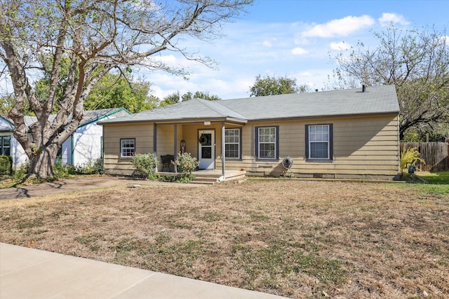 single story home featuring a front yard and covered porch