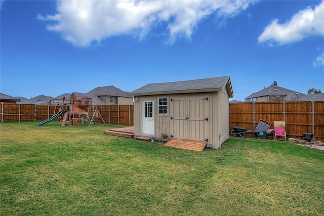 view of outbuilding featuring a yard and a playground