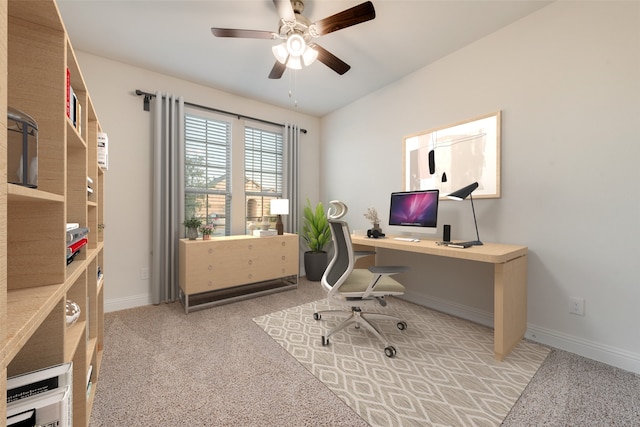 carpeted office space with ceiling fan