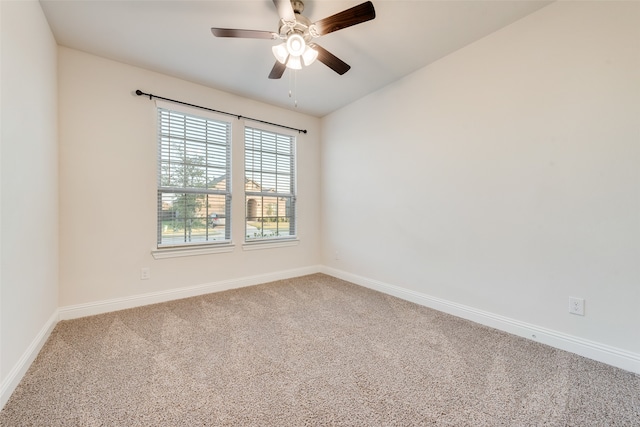 carpeted empty room with ceiling fan