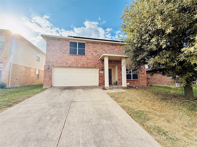 view of front of house with a garage and a front lawn