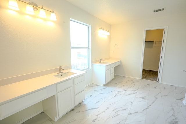 full bathroom with visible vents, baseboards, marble finish floor, and vanity