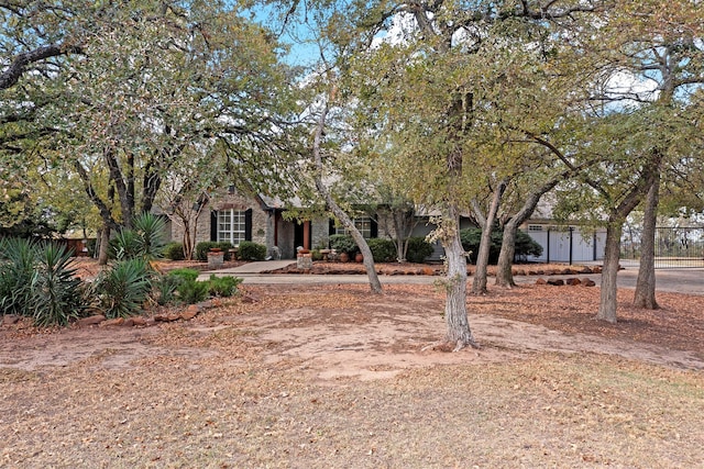 view of property hidden behind natural elements