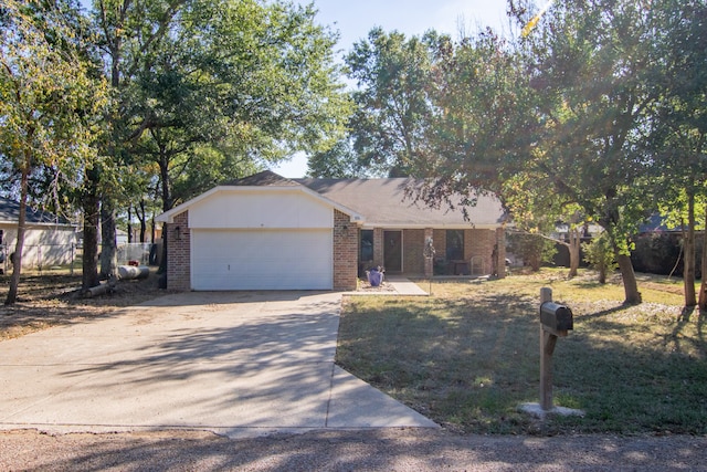 ranch-style house featuring a front yard and a garage