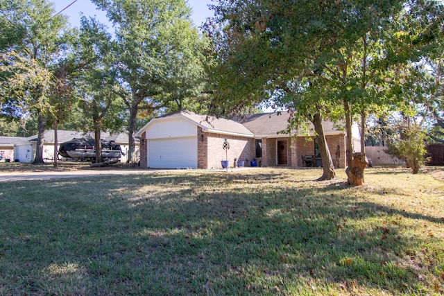 view of front facade with a front lawn and a garage