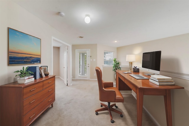 office area with light carpet, visible vents, and baseboards