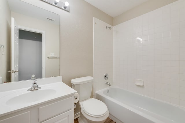 bathroom featuring visible vents, a textured wall, toilet, bathtub / shower combination, and vanity