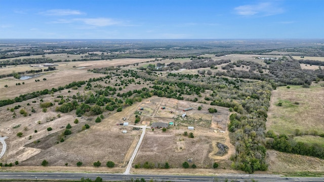 birds eye view of property with a rural view