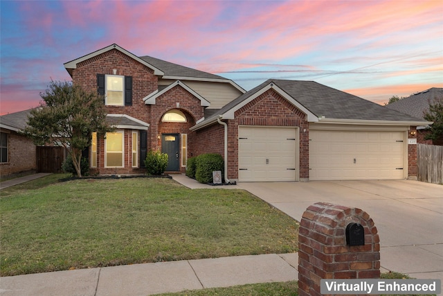 front of property with a garage and a lawn