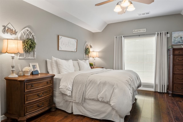 bedroom featuring ceiling fan, lofted ceiling, and dark hardwood / wood-style floors