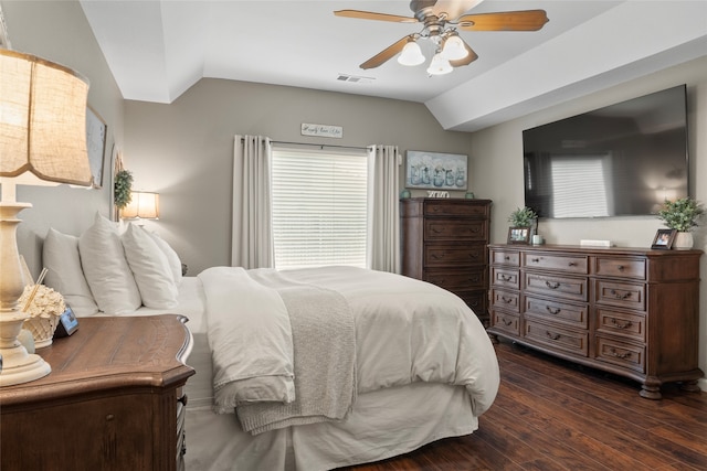 bedroom with lofted ceiling, dark wood-type flooring, and ceiling fan