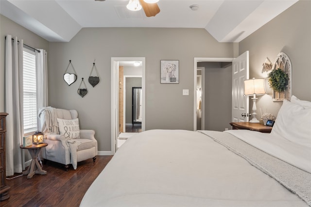 bedroom featuring lofted ceiling, multiple windows, dark hardwood / wood-style floors, and ceiling fan