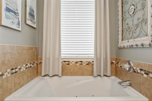 bathroom featuring a relaxing tiled tub